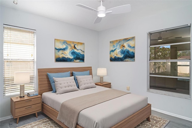 3805 Sandpointe Dr, Bradenton, FL 34205 - bedroom with a ceiling fan and wood finished floors