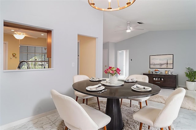 3805 Sandpointe Dr, Bradenton, FL 34205 - dining area featuring ceiling fan, marble finish flooring, and vaulted ceiling