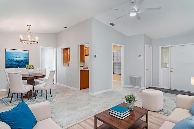 3805 Sandpointe Dr, Bradenton, FL 34205 - living room featuring a chandelier, lofted ceiling, and a ceiling fan
