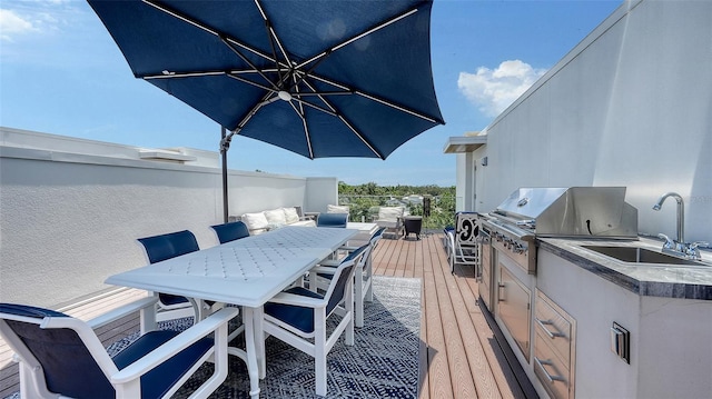 626 Rawls Ave Unit 626, Sarasota, FL 34236 - wooden terrace with outdoor dining space and exterior kitchen