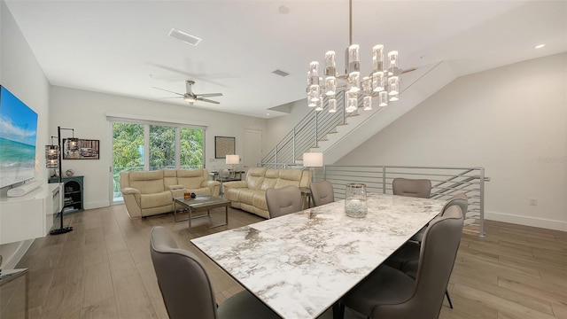 626 Rawls Ave Unit 626, Sarasota, FL 34236 - dining space featuring a ceiling fan, wood finished floors, and a chandelier