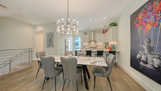626 Rawls Ave Unit 626, Sarasota, FL 34236 - dining room with light wood-type flooring, a chandelier, and recessed lighting