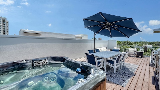 626 Rawls Ave Unit 626, Sarasota, FL 34236 - wooden deck with a hot tub and outdoor dining space