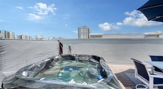 626 Rawls Ave Unit 626, Sarasota, FL 34236 - deck featuring a hot tub and a view of city