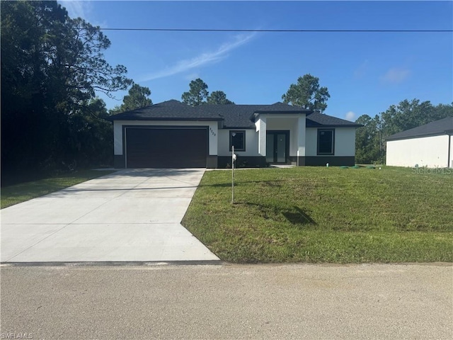 3003 18th St W, Lehigh Acres, FL 33971 - view of front of property featuring an attached garage, stucco siding, driveway, and a front yard