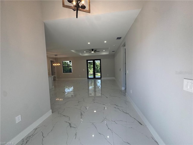 3003 18th St W, Lehigh Acres, FL 33971 - hallway featuring light marble finish floors, a chandelier, and recessed lighting
