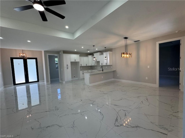 3003 18th St W, Lehigh Acres, FL 33971 - unfurnished living room featuring recessed lighting, light marble finish floors, a chandelier, french doors, and ceiling fan