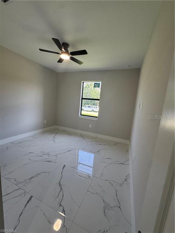 3003 18th St W, Lehigh Acres, FL 33971 - unfurnished room with a ceiling fan and marble finish floors