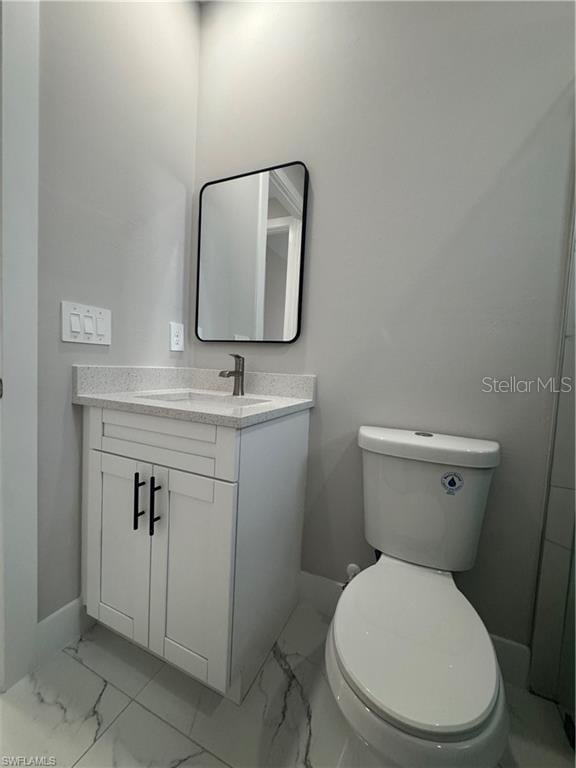 3003 18th St W, Lehigh Acres, FL 33971 - bathroom with marble finish floors and vanity