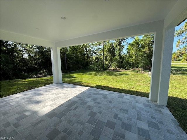 3003 18th St W, Lehigh Acres, FL 33971 - view of patio / terrace featuring view of scattered trees