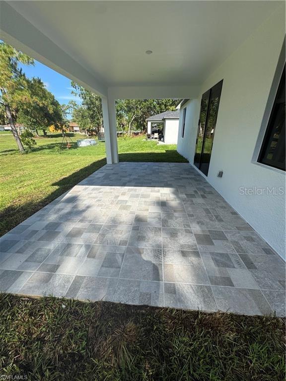 3003 18th St W, Lehigh Acres, FL 33971 - view of patio / terrace