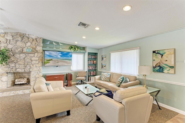 500 Park Blvd S Unit 97, Venice, FL 34285 - carpeted living area with a stone fireplace, recessed lighting, and a textured ceiling