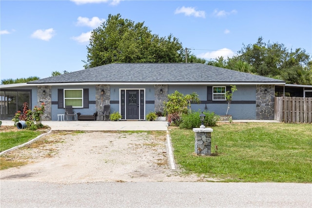 17211 Drayton Ln, Port Charlotte, FL 33948 - ranch-style home with roof with shingles and stone siding
