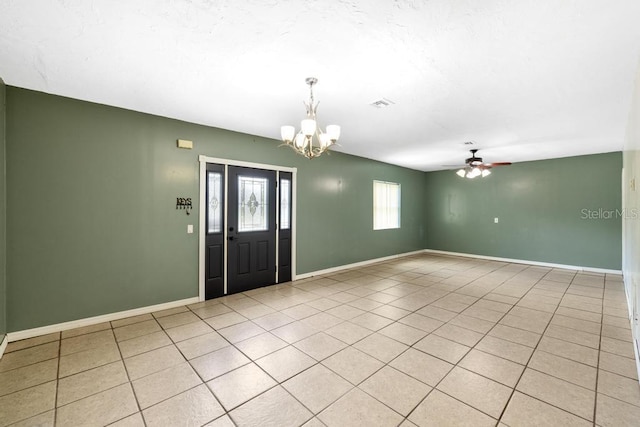 17211 Drayton Ln, Port Charlotte, FL 33948 - foyer featuring a chandelier, a ceiling fan, and light tile patterned flooring