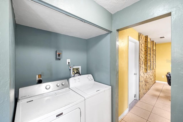 17211 Drayton Ln, Port Charlotte, FL 33948 - laundry room featuring washing machine and clothes dryer and light tile patterned floors
