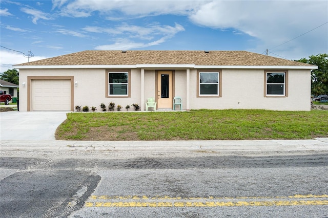 1515 2nd Ave W, Palmetto, FL 34221 - single story home with an attached garage, stucco siding, a front yard, and concrete driveway
