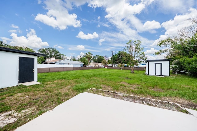 211 22nd Street Ct NE, Bradenton, FL 34208 - view of yard with a storage unit and a patio area