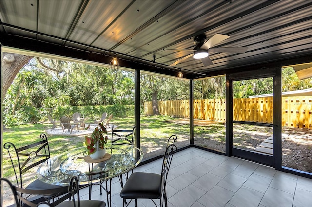 4041 Linwood St, Sarasota, FL 34232 - sunroom / solarium with ceiling fan, a fire pit, and healthy amount of natural light