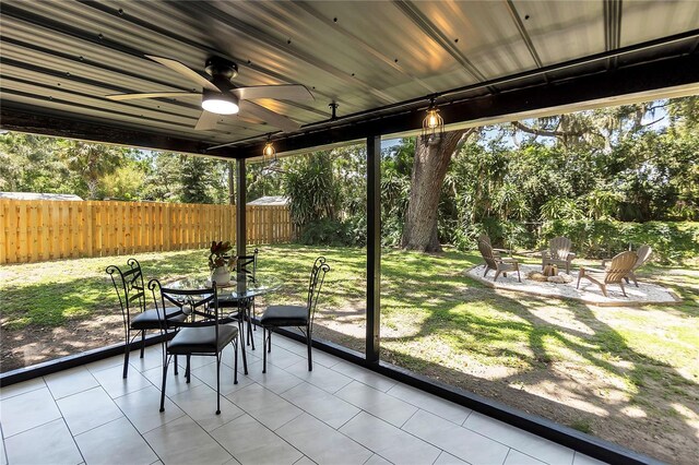 4041 Linwood St, Sarasota, FL 34232 - sunroom featuring ceiling fan, an outdoor fire pit, and outdoor dining area