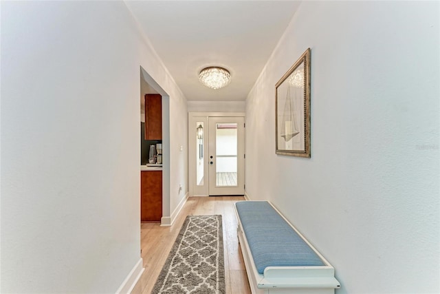 6111 Courtside Dr Unit 61, Bradenton, FL 34210 - doorway featuring light wood-style flooring and a chandelier