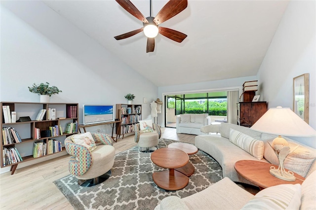 6111 Courtside Dr Unit 61, Bradenton, FL 34210 - living room with wood finished floors, a ceiling fan, and high vaulted ceiling