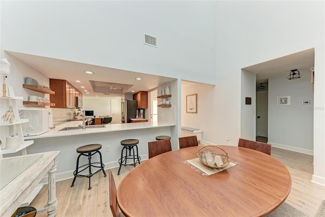 6111 Courtside Dr Unit 61, Bradenton, FL 34210 - dining area featuring light wood-type flooring and recessed lighting