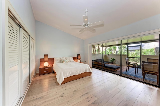 6111 Courtside Dr Unit 61, Bradenton, FL 34210 - bedroom featuring vaulted ceiling, access to outside, light wood-type flooring, a ceiling fan, and a closet