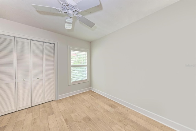 6111 Courtside Dr Unit 61, Bradenton, FL 34210 - unfurnished bedroom with a closet, light wood finished floors, and a ceiling fan