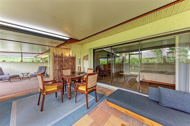 6111 Courtside Dr Unit 61, Bradenton, FL 34210 - sunroom with healthy amount of natural light and outdoor dining area