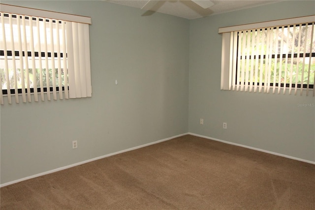 753 Tropical Cir, Sarasota, FL 34242 - empty room featuring carpet flooring and a ceiling fan