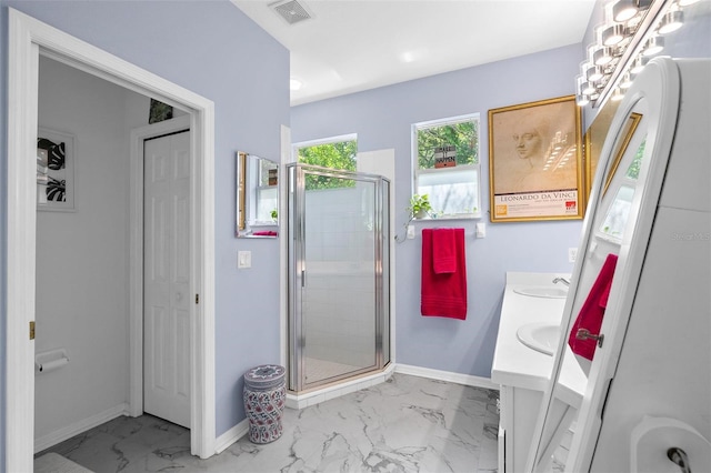 7747 33rd St E, Sarasota, FL 34243 - bathroom featuring marble finish floors, a shower stall, and double vanity
