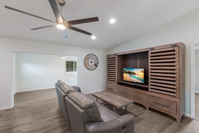 8985 Pohoy Ave, Sarasota, FL 34231 - living room with vaulted ceiling, wood finished floors, ceiling fan, and recessed lighting