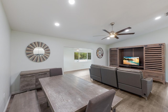 8985 Pohoy Ave, Sarasota, FL 34231 - dining area with light wood-style flooring, a ceiling fan, lofted ceiling, and recessed lighting