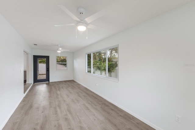 8985 Pohoy Ave, Sarasota, FL 34231 - unfurnished room featuring light wood-style flooring and a ceiling fan