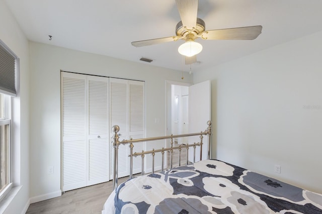 8985 Pohoy Ave, Sarasota, FL 34231 - bedroom featuring light wood-type flooring, a closet, and a ceiling fan