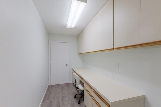 8985 Pohoy Ave, Sarasota, FL 34231 - office space with light wood finished floors and built in study area