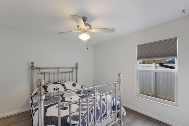 8985 Pohoy Ave, Sarasota, FL 34231 - bedroom with wood finished floors and a ceiling fan