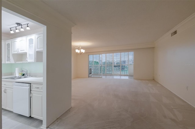 3680 Ironwood Cir Unit 603L, Bradenton, FL 34209 - unfurnished living room featuring ornamental molding, a chandelier, and light colored carpet