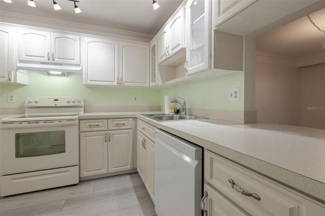 3680 Ironwood Cir Unit 603L, Bradenton, FL 34209 - kitchen with white appliances, under cabinet range hood, glass insert cabinets, white cabinets, and crown molding
