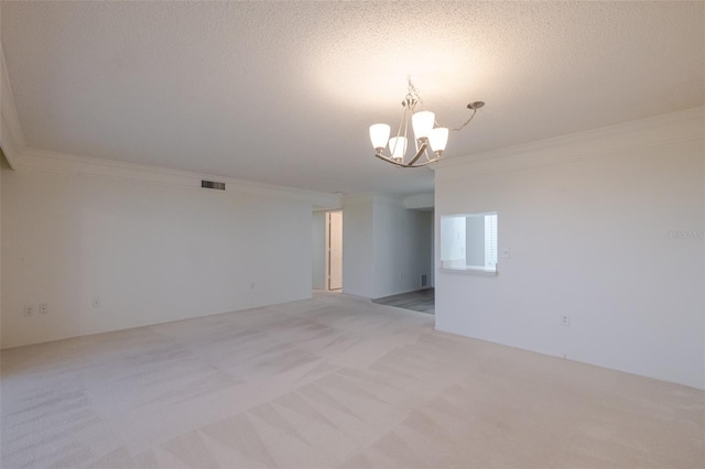 3680 Ironwood Cir Unit 603L, Bradenton, FL 34209 - empty room with ornamental molding, a chandelier, light colored carpet, and a textured ceiling