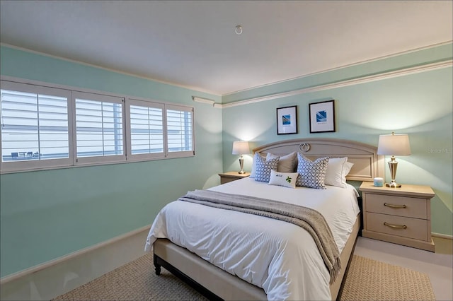3680 Ironwood Cir Unit 603L, Bradenton, FL 34209 - bedroom with baseboards and ornamental molding