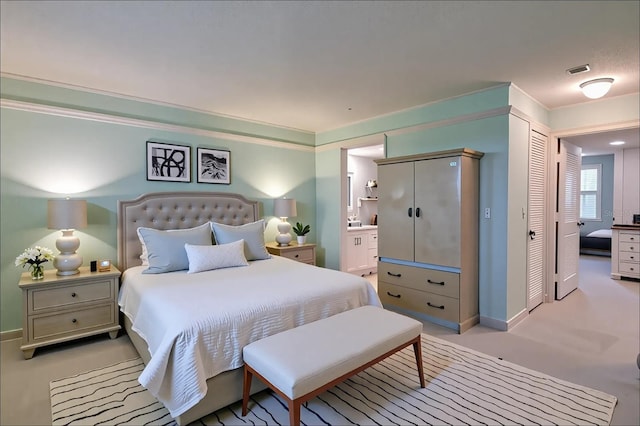 3680 Ironwood Cir Unit 603L, Bradenton, FL 34209 - bedroom with ensuite bathroom and baseboards