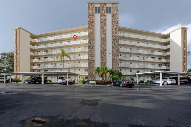 3680 Ironwood Cir Unit 603L, Bradenton, FL 34209 - view of property with covered and uncovered parking