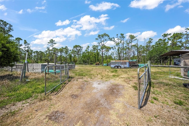8146 Tropicaire Blvd, North Port, FL 34291 - view of dirt / gravel driveway featuring a gated entry