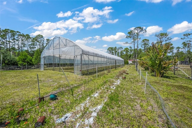 8146 Tropicaire Blvd, North Port, FL 34291 - view of yard featuring a greenhouse and an outdoor structure