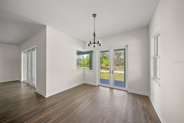 8146 Tropicaire Blvd, North Port, FL 34291 - unfurnished dining area with a chandelier and dark wood-style flooring