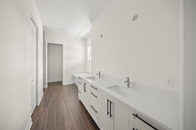 8146 Tropicaire Blvd, North Port, FL 34291 - bathroom featuring wood finished floors and double vanity