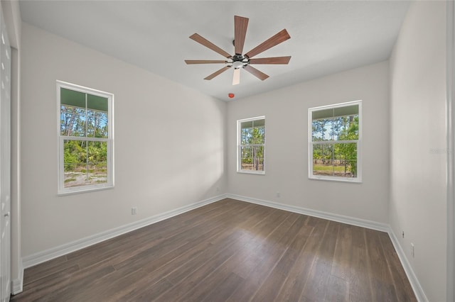 8146 Tropicaire Blvd, North Port, FL 34291 - spare room featuring dark wood-type flooring and a ceiling fan