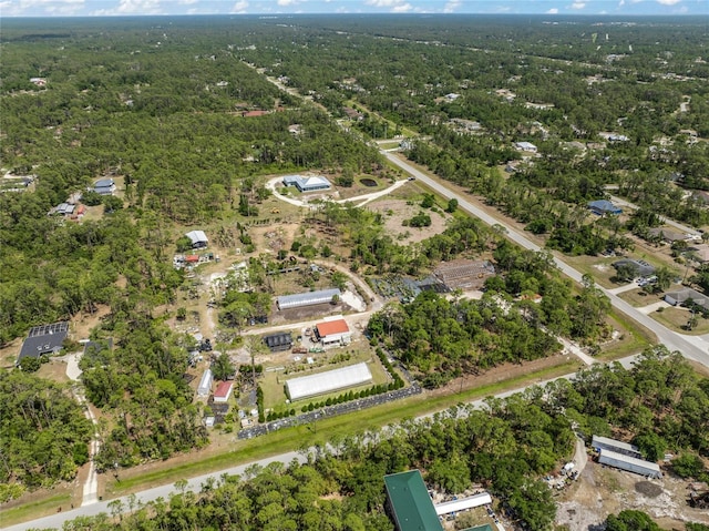 8146 Tropicaire Blvd, North Port, FL 34291 - aerial view of property and surrounding area featuring a heavily wooded area
