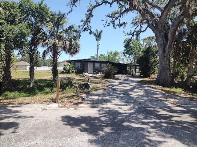 1423 17th Ave E, Bradenton, FL 34208 - view of front facade with driveway and an attached carport
